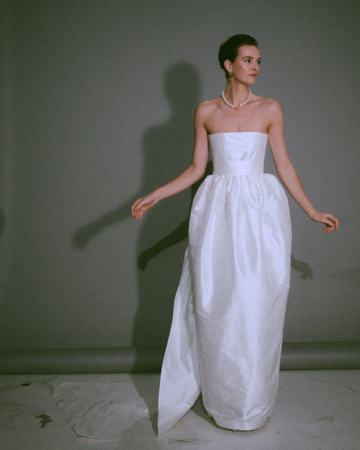 Front view of the Cece bustier wedding gown with a tulip-shaped silk skirt, handmade, available at Georgette bridal boutique in Brussels and online at georgettebridal.com.