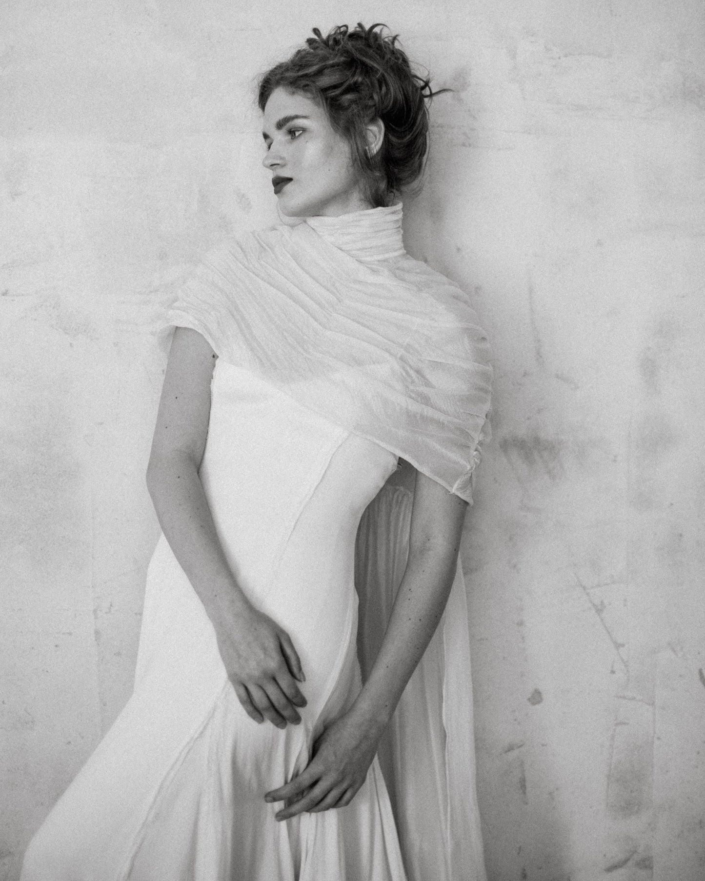 Bride wearing the Elise Cape 100% Silk Tule by The Muse Collective handmade in Spain available at Georgette in Brussels and online
