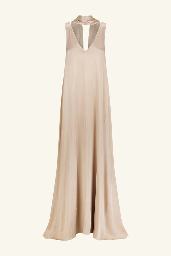 Product shot, elegant golden maxi dress with a deep plunging neckline and draped scarf detail, made from satin-finish LENZING™ ECOVERO™ viscose for a sophisticated, fluid look. Available at Georgette bridal boutique in Brussels and online at georgettebridal.com.