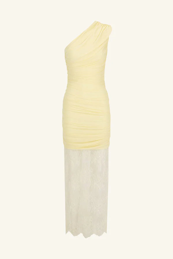 Product shot, asymmetrical yellow one-shoulder maxi dress featuring sheer mesh and delicate lace contrast, gathered details, and a flowing lace skirt with a subtle back split. Available at Georgette bridal boutique in Brussels and online at georgettebridal.com.