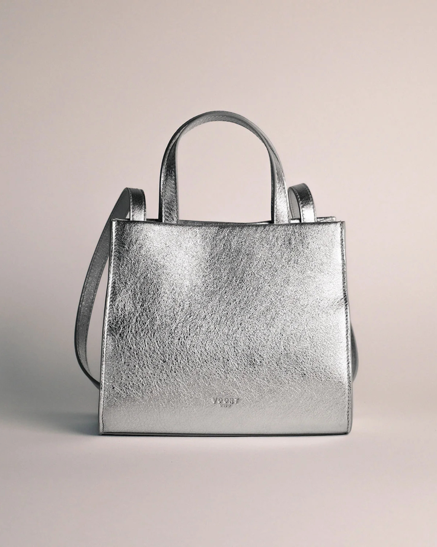 Silver mini leather crossbody bag with adjustable strap by Voort Studio, available at Georgette bridal boutique in Brussels and online at georgettebridal.com