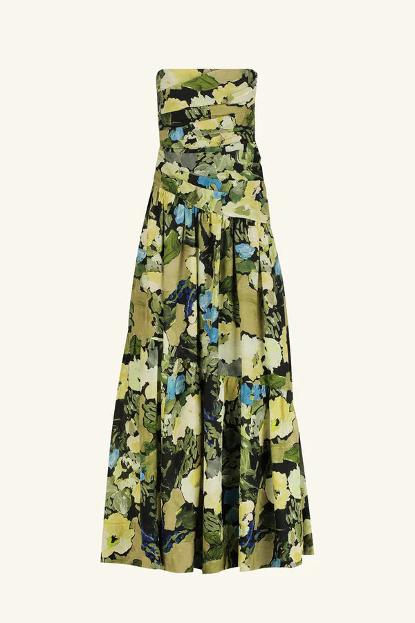 Product shot, a strapless tiered maxi dress in a sheer Botanical Floral print, featuring a softly draped asymmetrical bodice, full tiered skirt, and invisible side zip. Crafted from a linen and TENCEL™ blend. Available at Georgette bridal boutique in Brussels and online at georgettebridal.com.