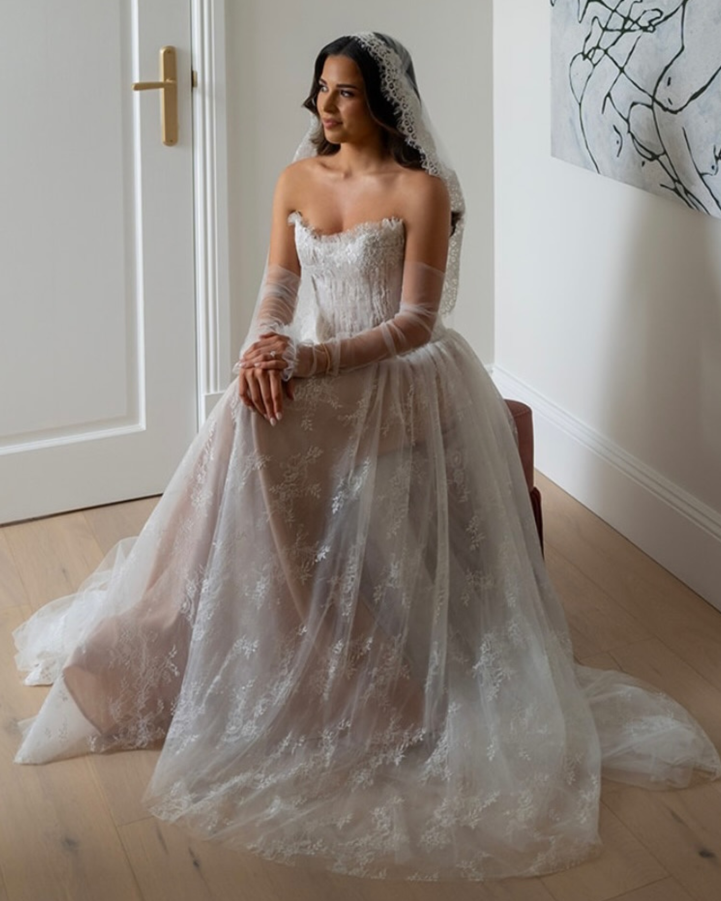 Bride in  Calla luxury semi-sheer lace wedding dress by Floure available at Georgette bridal Brussels