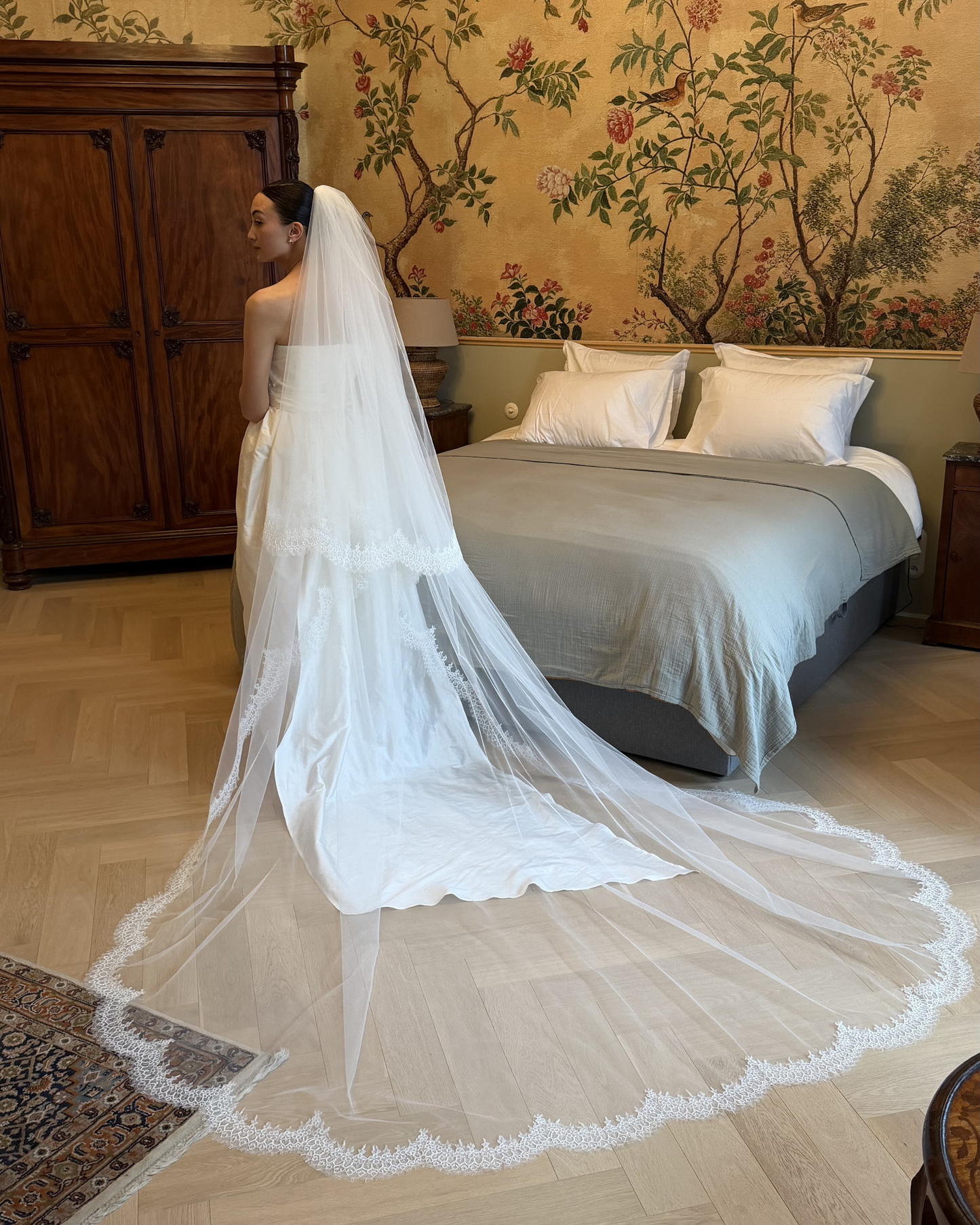 Ivory cathedral veil with lace border and long train, available at Georgette bridal boutique in Brussels and online at georgettebridal.com