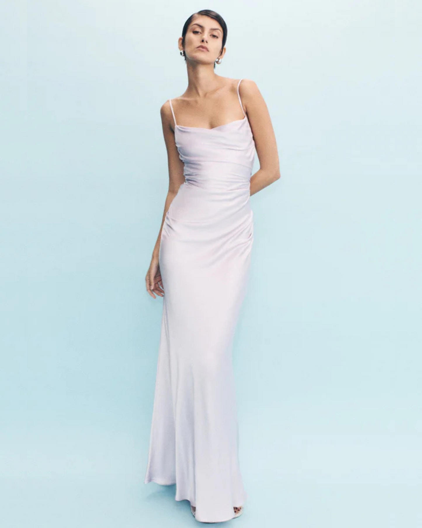 Model posing in the La Lune Maxi Dress in lilac with ruched bodice and square neckline
