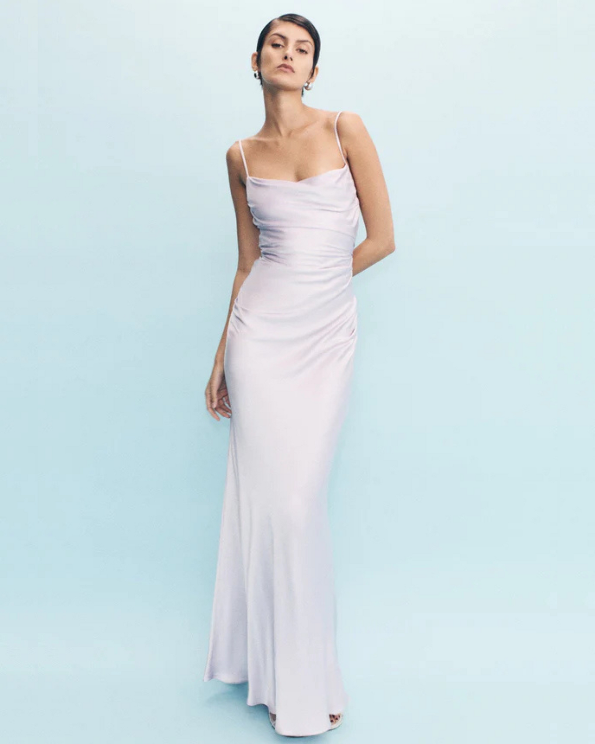 Model posing in the La Lune Maxi Dress in lilac with ruched bodice and square neckline