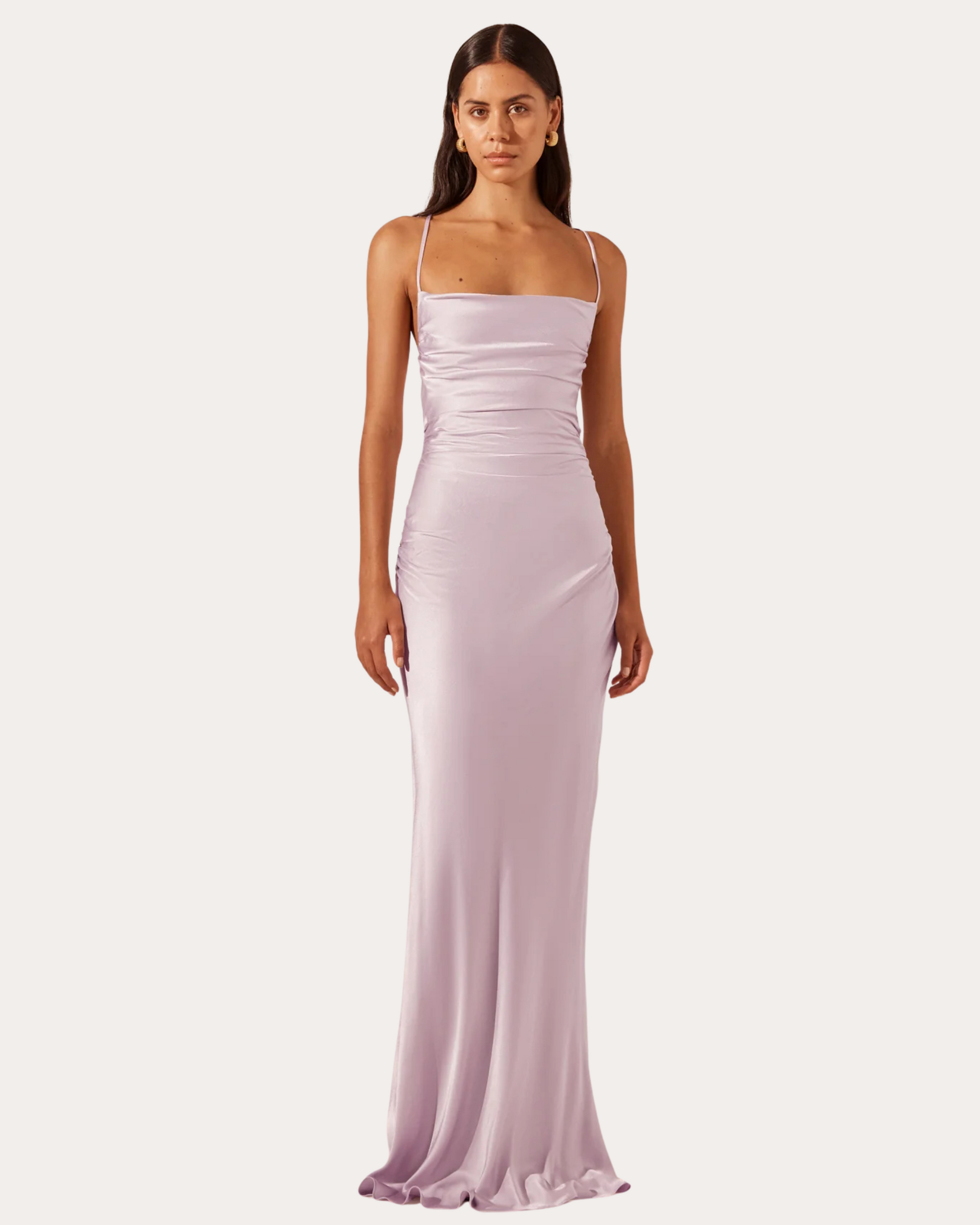 Model wearing a lilac satin La Lune Cross Back Maxi Dress with square neckline and thin straps, available at Georgette Brussels