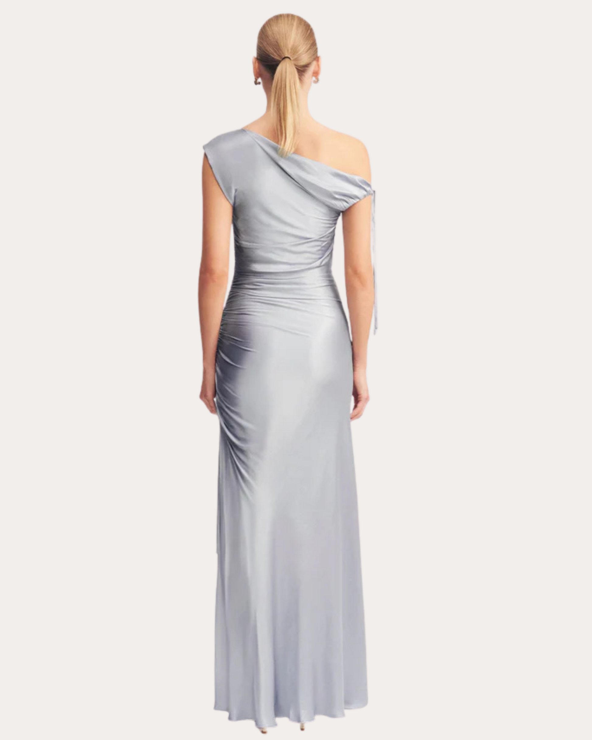 Back view of the La Lune One-Shoulder Gathered Maxi Dress featuring a shoulder tie and flowing maxi-length skirt, available at Georgette Bridal in Brussels.