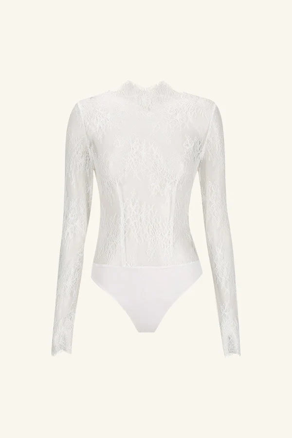 Product shot of the Lambent Lace Long Sleeve Bridal Bodysuit with intricate lace detailing and a high neckline, offering a timeless and sophisticated bridal look. Available at Georgette bridal boutique in Brussels and online at georgettebridal.com.