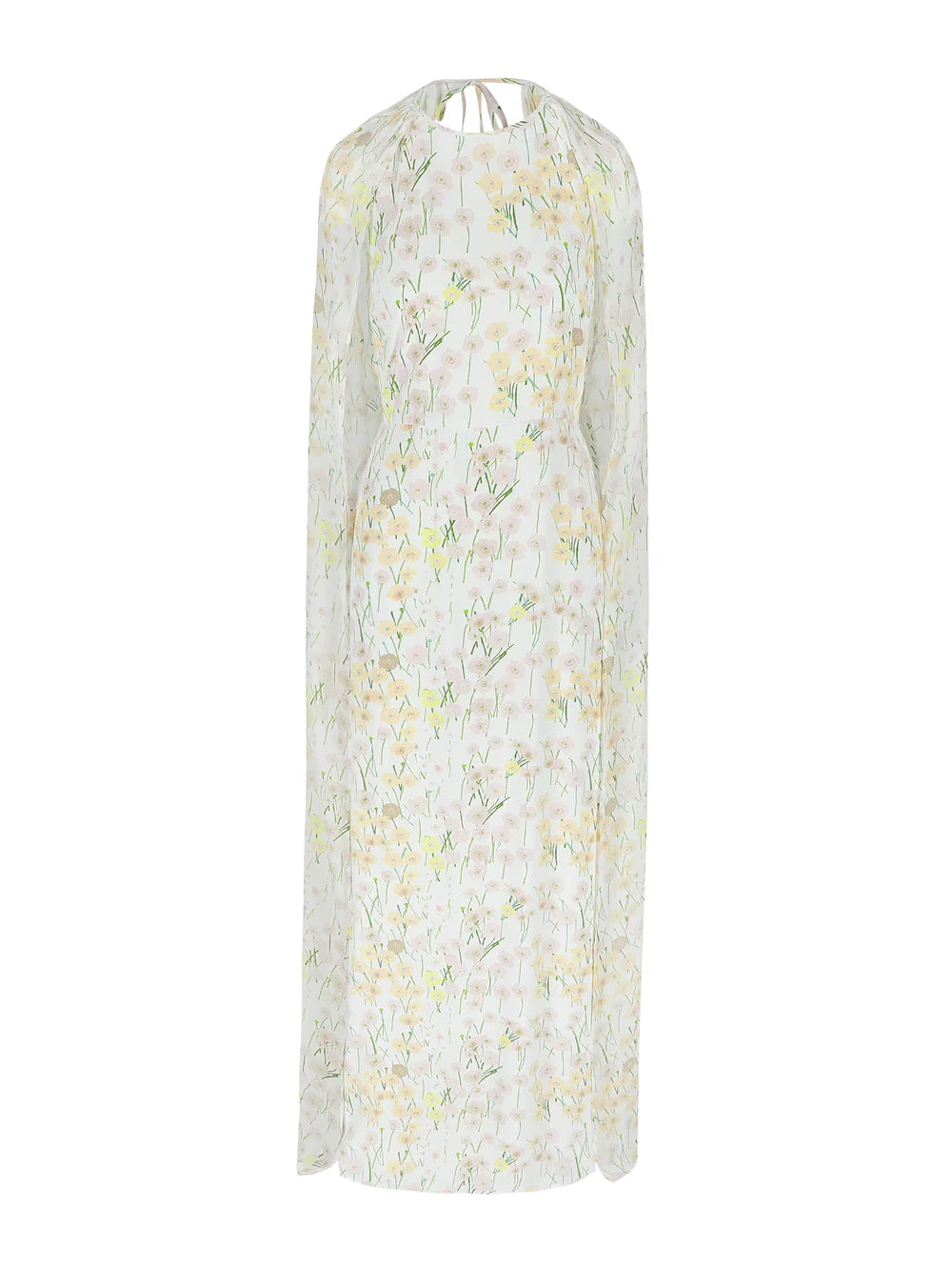 The Mina cape dress with a cinched waist and open back, featuring a pastel Buttercups floral print on ivory. The flowing cape can be draped over the shoulders or worn loose, creating an elegant floor-length silhouette. Available at Georgette bridal boutique in Brussels and online at georgettebridal.com.