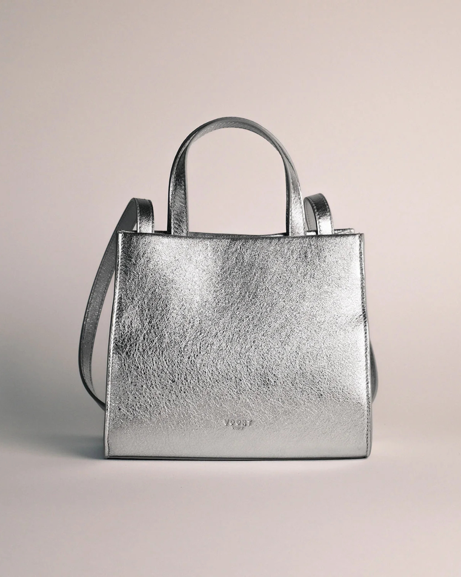 Silver mini leather crossbody bag with adjustable strap by Voort Studio, available at Georgette bridal boutique in Brussels and online at georgettebridal.com