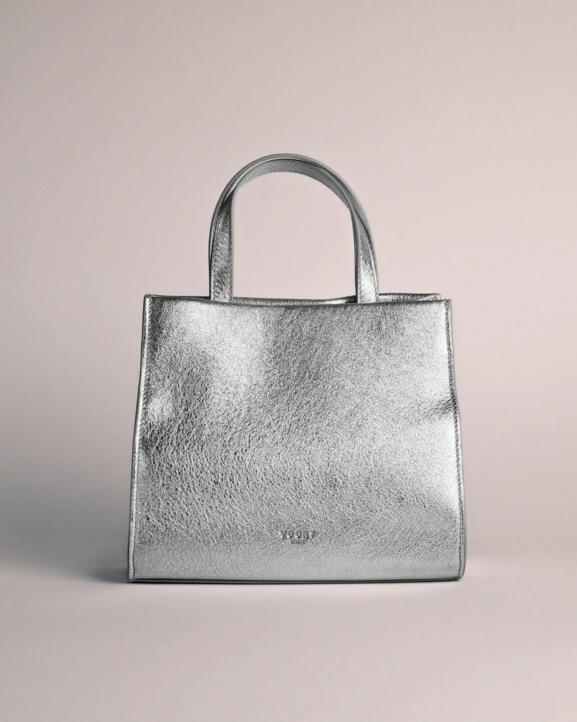 Silver mini leather handbag with top handle, available at Georgette bridal boutique in Brussels and online at georgettebridal.com