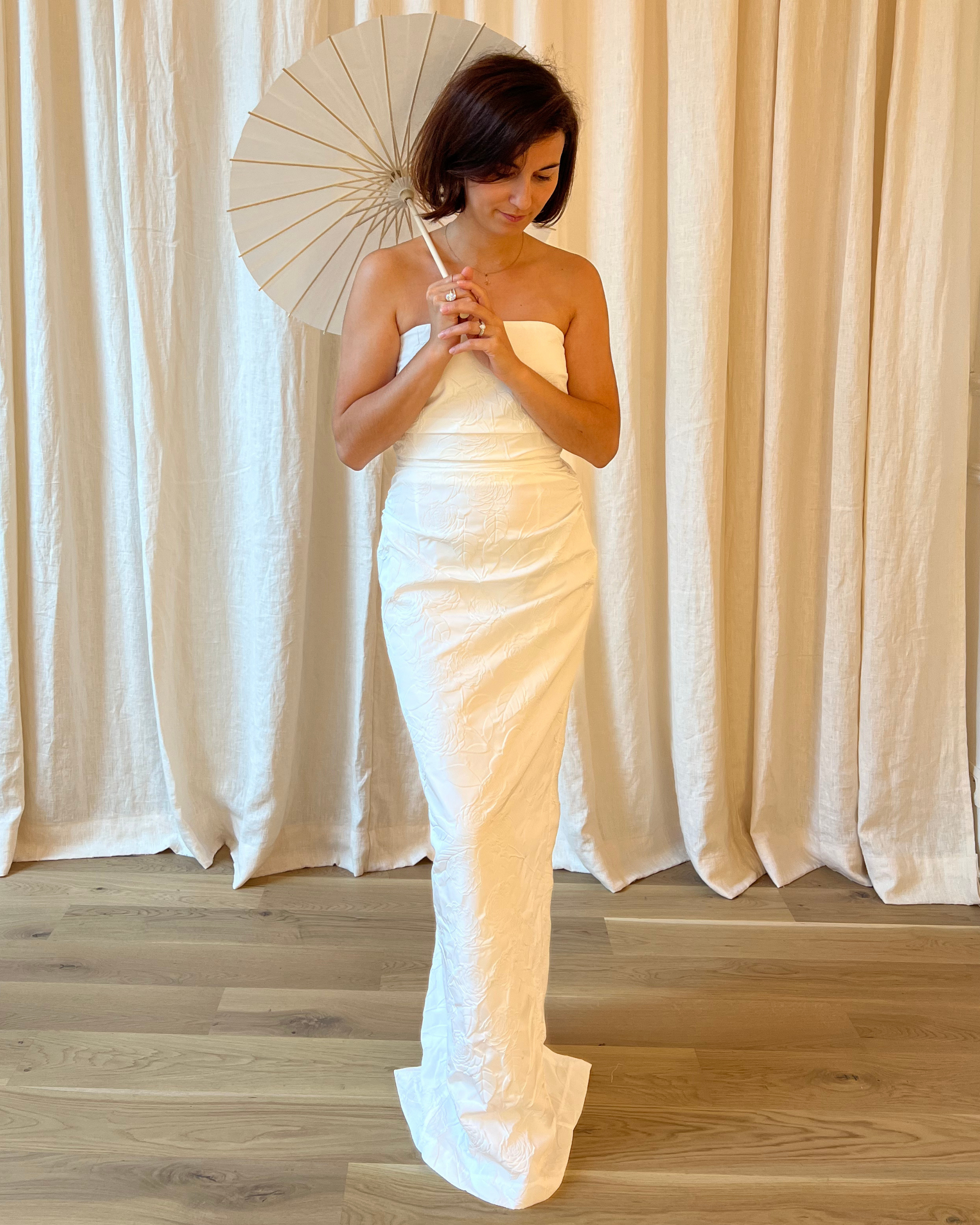 Vera Bustier Camellia Embossed Wedding Dress by Bernadette + umbrella