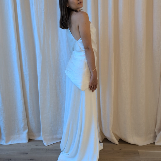Woman trying on the Lucia Set by The Muse Collective available at Georgette Studio in Brussels